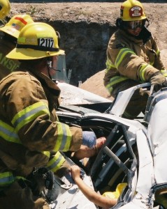 firefighters cutting open car